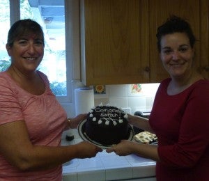 Roberta and Sarah with Sarah's celebratory "Mark Transmission" cake